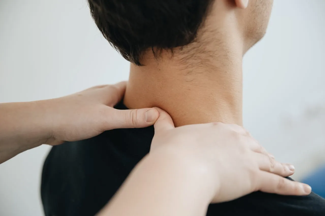 Clients neck being massaged.