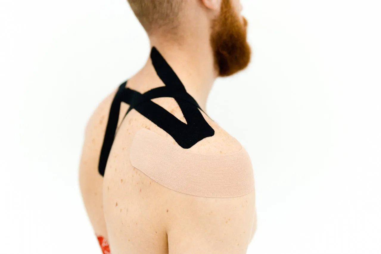 Kinesiology tape applied to the shoulders.